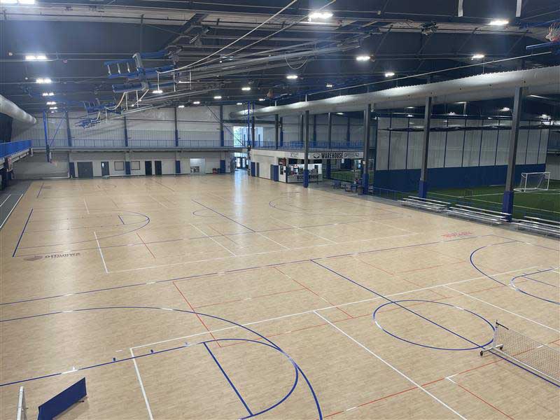 Indoor turf soccer field behind safety netting at Southeast Iowa Sports Center for the ImpactLife Blood Drive in Ottumwa, Iowa